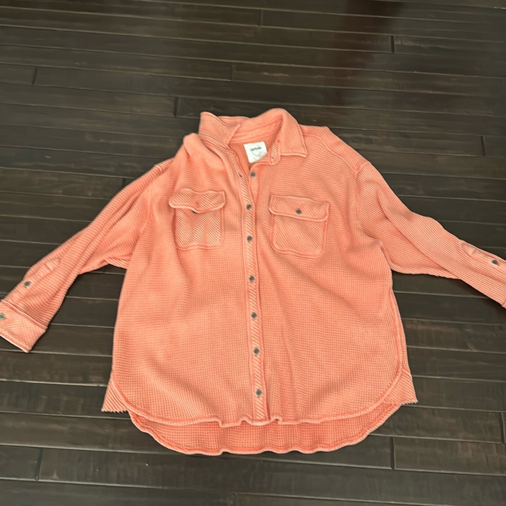 A light orange, lightly worn, comfy, waffle, oversize sweatshirt